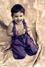 Colored photo of little boy laughing
